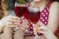 Glasses of red wine. Toast at a party. Concept of alcohol, holiday