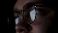 Glasses with reflected computer screen in lenses. Concept. Close up of thoughtful business man face or focused student Royalty Free Stock Photo