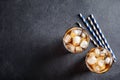 Glasses of refreshing cola with ice cubes on grey, top view. Space for text Royalty Free Stock Photo