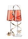 Glasses of rose champagne with gold streamer isolated Royalty Free Stock Photo