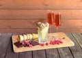 Rose champagne, chocolate ice cream, pieces of dark chocolate, fresh raspberry  and empty waffle cones near on rustic wooden table Royalty Free Stock Photo