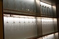 Glasses in a row on the illuminated shelf Royalty Free Stock Photo