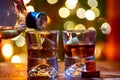 Glasses of scotch whisky served in bar in Edinburgh, Scotland, UK and pasry lights on background