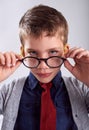 Glasses, serious and portrait of child in studio for eye care, vision and optical health. Looking, optometry and young Royalty Free Stock Photo