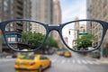 glasses with sharp and blurred big city Royalty Free Stock Photo