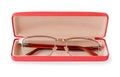 Glasses for sight with a golden rim in a pink glasses case. Golden eye glasses for reading and computer work. Myopia, hyperopia Royalty Free Stock Photo