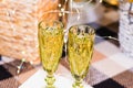 Glasses of sparkling champagne near the Christmas tree, garland and Christmas decoration. Christmas and New Year Royalty Free Stock Photo