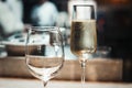 2 glasses with sparkling champaign with bubbles stand on the table in the restaurant Royalty Free Stock Photo