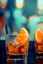 Glasses of spritz aperitif aperol cocktail with orange slices and ice cubes on bar table, pop style atmosphere background Royalty Free Stock Photo