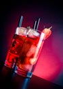 Glasses of strawberry cocktail with ice on wood table Royalty Free Stock Photo