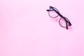 Glasses or sunglasses object fashion minimal modern style, accessory travel on Pink pastel color background. Royalty Free Stock Photo