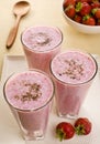 Glasses of Sweet Strawberry Lassi and Strawberries