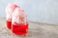 Glasses with tasty cotton candy cocktail on grunge table Royalty Free Stock Photo