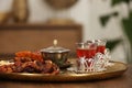 Glasses with tasty Turkish tea and oriental sweets on wooden table indoors, space for text