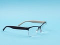 Glasses to improve vision on a blue background. Royalty Free Stock Photo