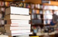 Glasses on top of different books lying on table in school libra Royalty Free Stock Photo