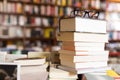 Glasses on top of stack of books lying on table in bookstore Royalty Free Stock Photo