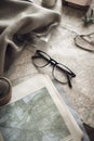 Glasses, travel blanket and maps, copy space, created using generative ai technology