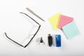 Glasses, USB, and Colored Notepaper Ready for Use in Organized Workspace