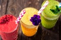 Glasses of various fruit smoothies with small details fine decoration