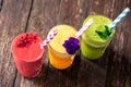 Glasses of various fruit smoothies with small details fine decoration