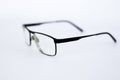 Glasses for the visually impaired, poorly sighted.glasses with aspherical astigmatic lenses in black frame on a white background.