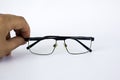 Glasses for the visually impaired, poorly sighted.glasses with aspherical astigmatic lenses in black frame on a white background.