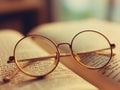 The glasses were on top of the book on the table in the living room. Royalty Free Stock Photo