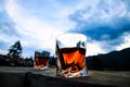 Glasses of whiskey on mountain landscape background Royalty Free Stock Photo