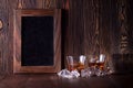Glasses of whiskey on wood background Royalty Free Stock Photo