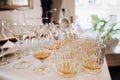 Glasses of whisky, cognac, scotch, martini on table on wedding party