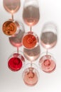 Glasses of white and pink wine with their shadows Royalty Free Stock Photo