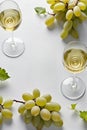 Glasses of white wine and green grapes Royalty Free Stock Photo