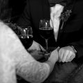 Glasses with wine in bride and groom hands Royalty Free Stock Photo