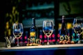 Glasses and wine buttles on bartender Royalty Free Stock Photo