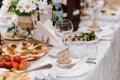 glasses for wine and drinks on the laid festive table in the restaurant Royalty Free Stock Photo