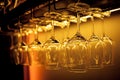 Glasses of wine. Glasses hanging above the bar in the restaurant. Empty glasses for wine Royalty Free Stock Photo