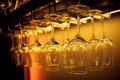 Glasses of wine. Glasses hanging above the bar in the restaurant. Empty glasses for wine Royalty Free Stock Photo