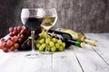 Glasses of wine and grapes on wooden background. red and white w Royalty Free Stock Photo