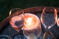 Glasses of wine illuminated by candles night party