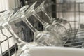 Glasses of wine are stacked rhythmically in the dishwasher. Royalty Free Stock Photo