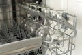 Glasses of wine are stacked rhythmically in the dishwasher. Royalty Free Stock Photo