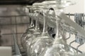 Glasses of wine are stacked rhythmically in the dishwasher. Royalty Free Stock Photo