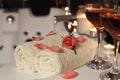 Glasses of wine, towels and rose on tub in bathroom, closeup. Romantic atmosphere Royalty Free Stock Photo