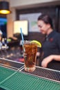 Glassful of Coca - Cola with ice and a slice of lemon