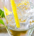 Glasss of mojito with lemon and drinking straw Royalty Free Stock Photo