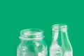 Glassware crystal bottle jar on green background. Reusable materials plastic-free alternatives zero waste environmental protection