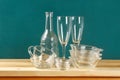 Glassware. Glass plates, cups, bowls. Dishes on shelf. Kitchenware