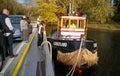 Tugboat guiding car and passenger barge for a short trip Royalty Free Stock Photo