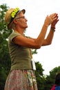 Glastonbury Festival older woman in daisy hat